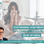 Woman sneezing at home showing indoor allergy symptoms and allergy treatment in Indore by Dr S Z Jafrey